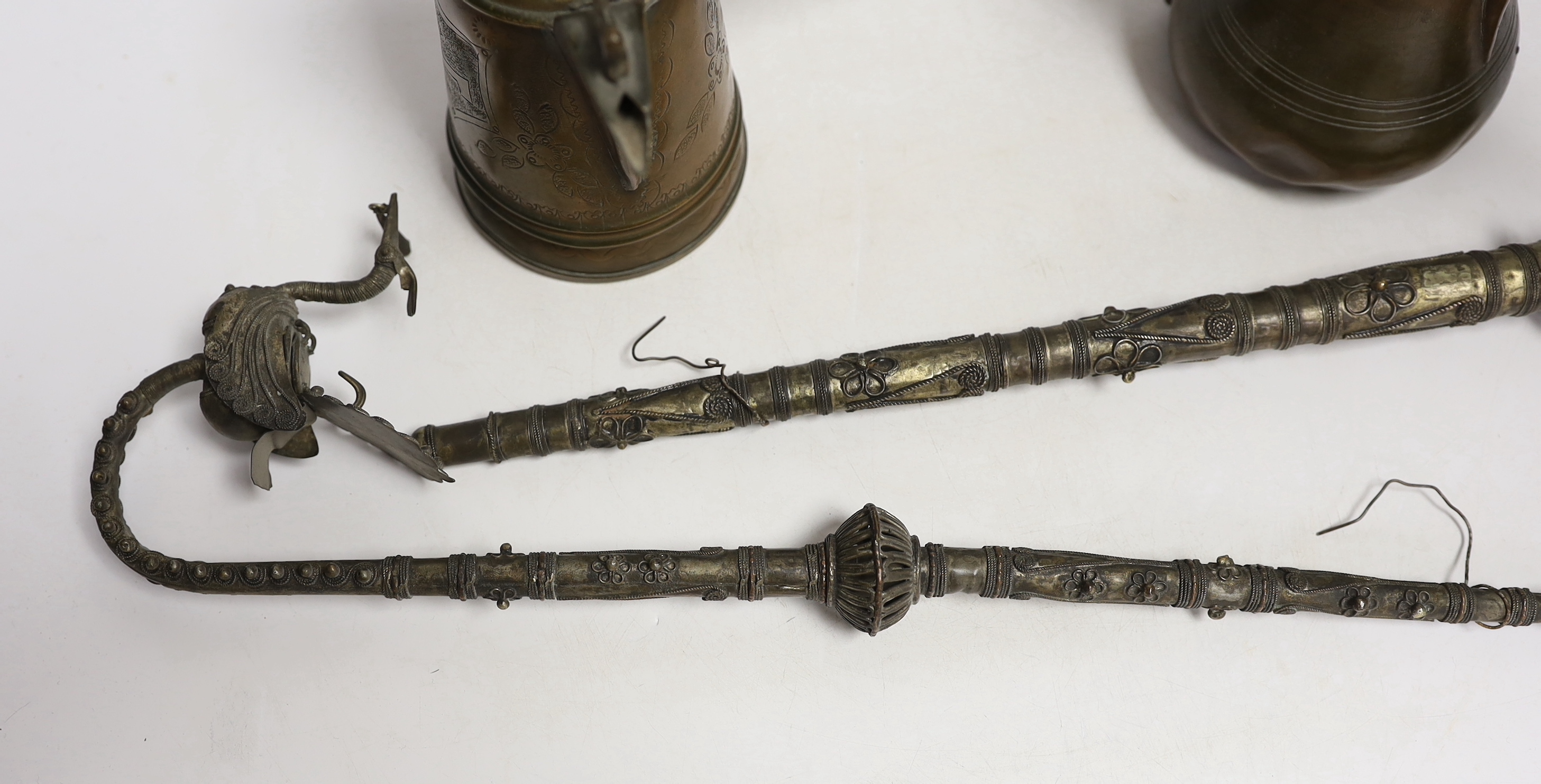 Two Indian opium pipes and two Dallah coffee pots, tallest pot 22cm